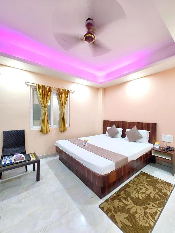 Clean and affordable budget hotel room interior with a double bed and modern amenities.
