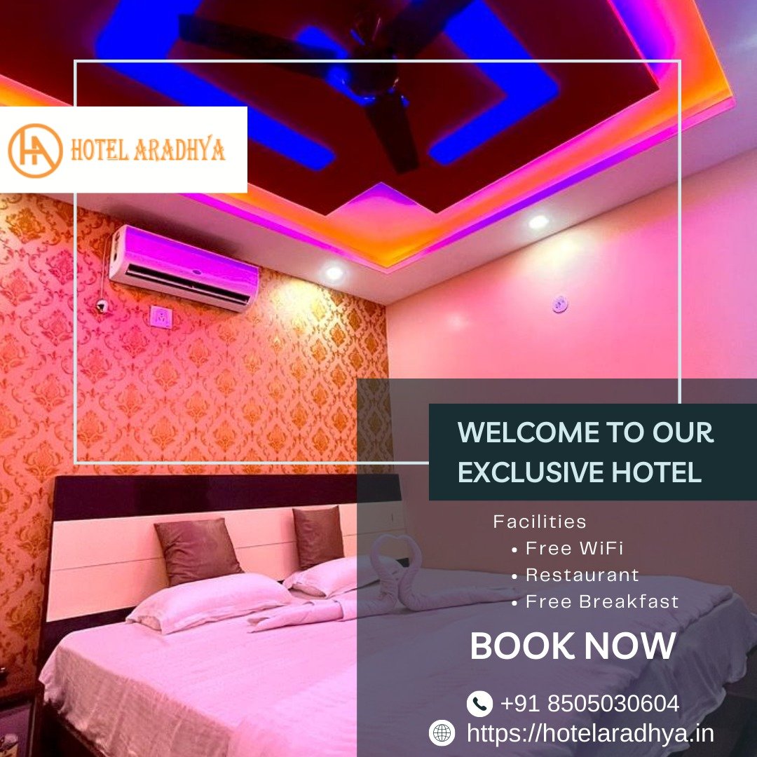 Luxury hotel room interior featuring a king-size bed, warm ambient lighting, and elegant decor