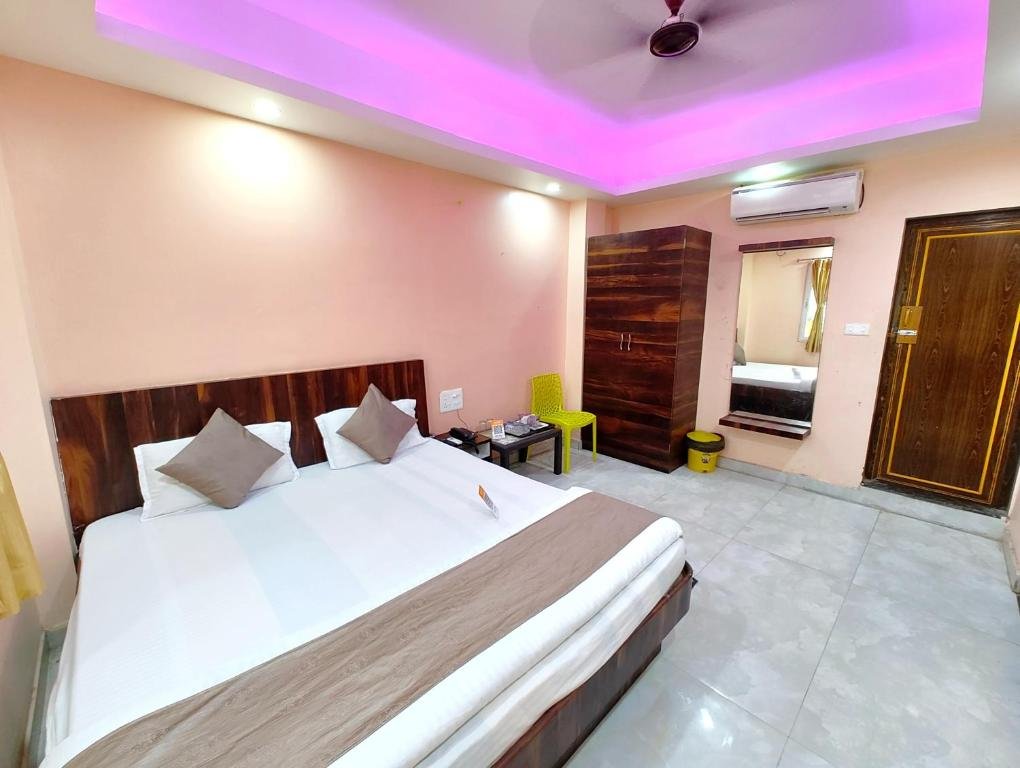 Modern boutique hotel lobby interior with trendy casual seating, indoor plants, and stylish architecture.