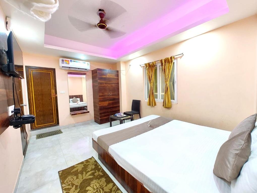 Clean and affordable budget hotel room interior with a double bed and modern amenities.